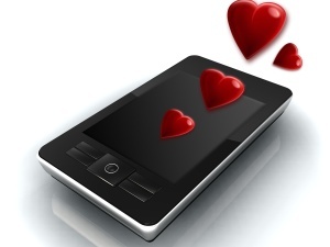 Enterprise mobile phone with hearts symbolizing infatuation Enterprise mobile phone with hearts symbolizing infatuation