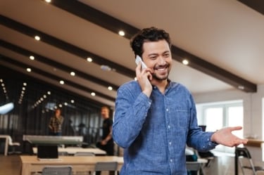 Man Talking on Phone in Office Man Talking on Phone in Office